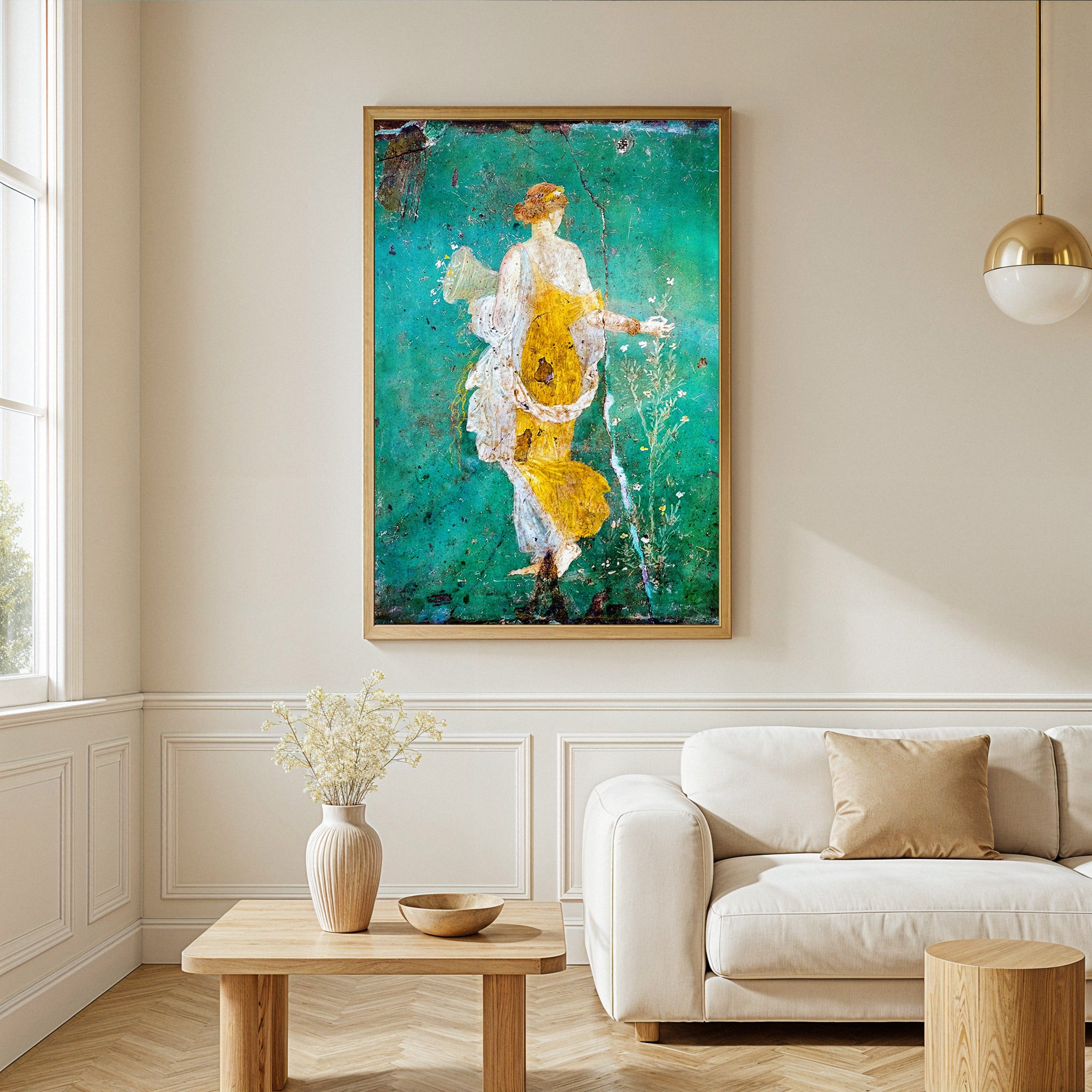Framed abstract painting of a woman in a yellow dress on a wall above a sofa in a living room.