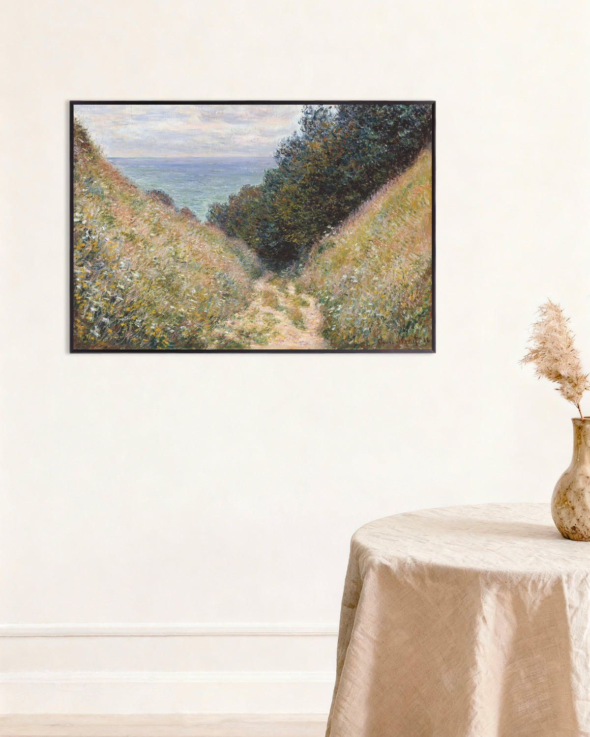 Claude Monet’n Rotkotie La Caveessa, Pourville (1882) -juliste metallikehyksessä